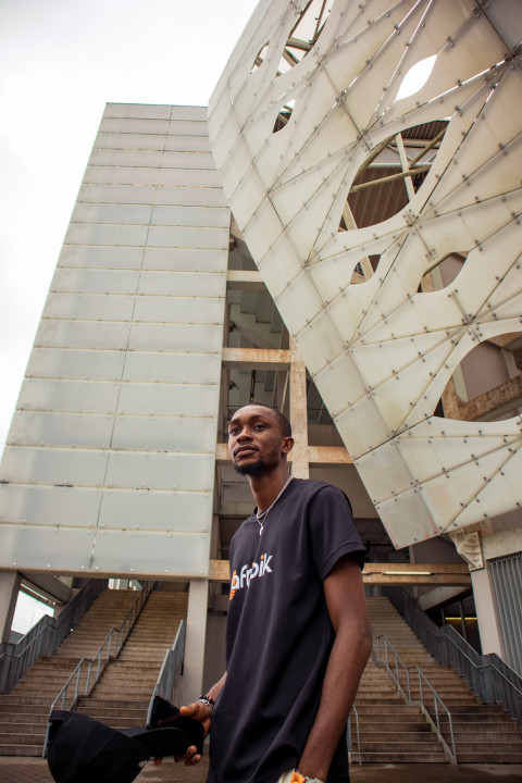 Boy in front of stadium