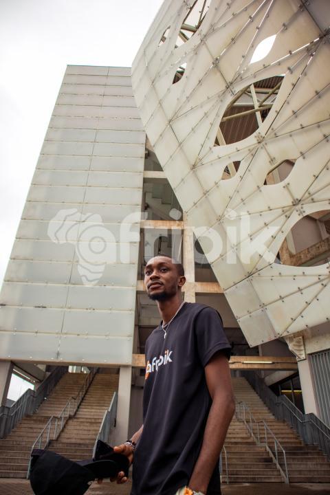 Boy in front of stadium