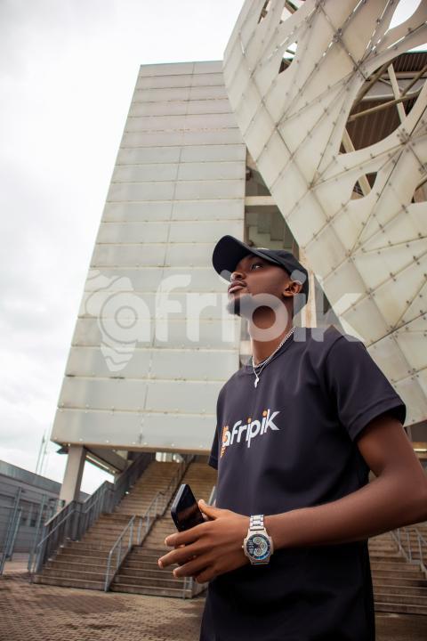 Boy in front of stadium 1