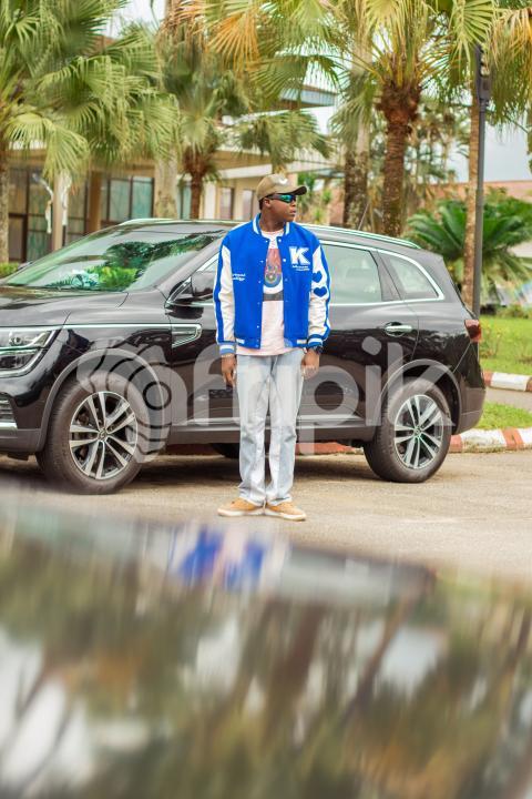 A boy in front of car 2