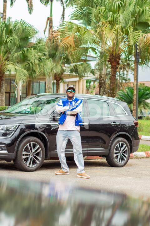 A boy in front of car 3