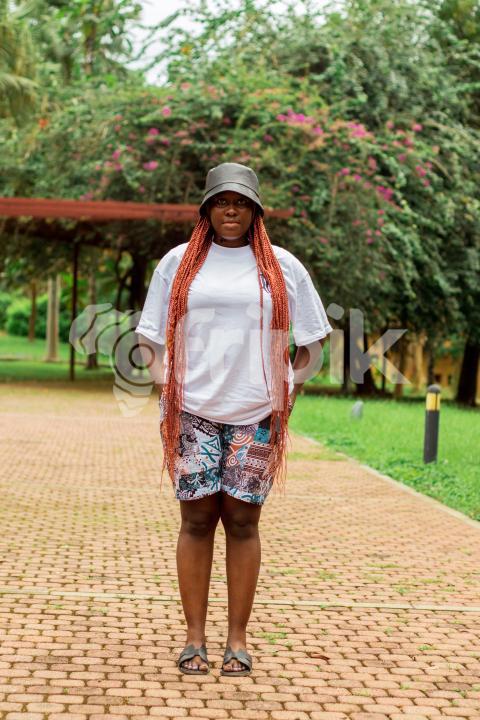 Girl standing in front of trees