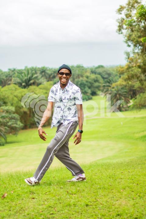 A happy boy in a beautiful grass lawn