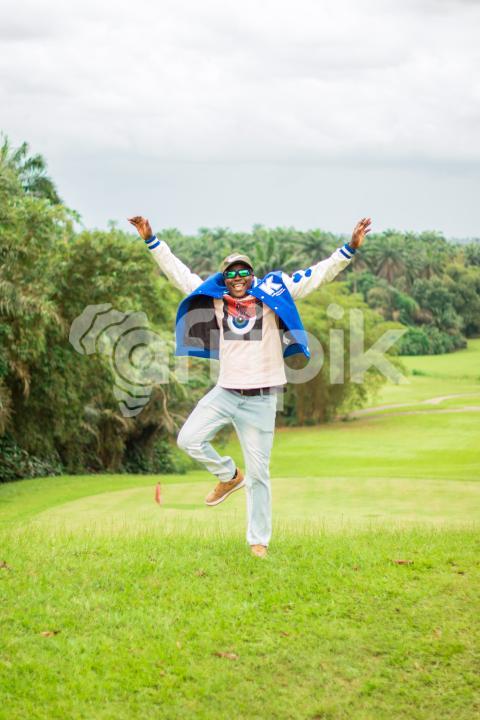 A boy jumping on a beautiful grass lawn 3