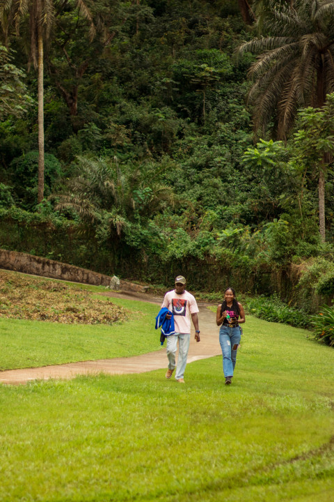 Boy and girl walking on grass