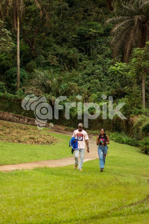 Boy and girl walking on grass