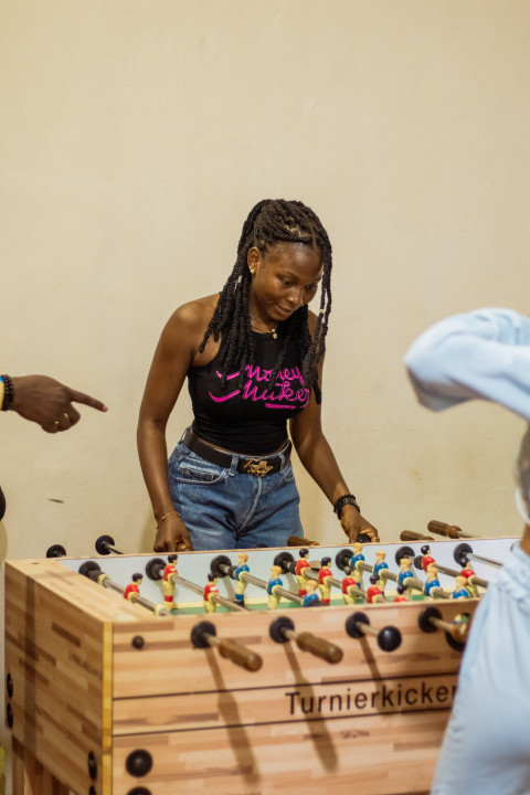 Girl playing foosball