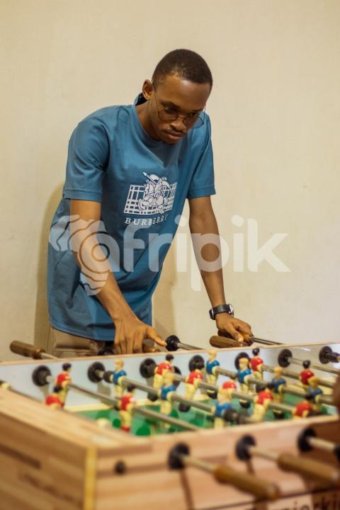 Boy playing foosball