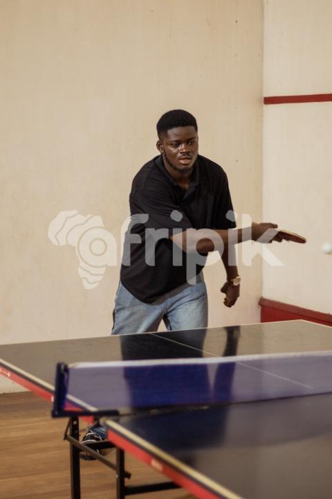 Boy playing table tennis