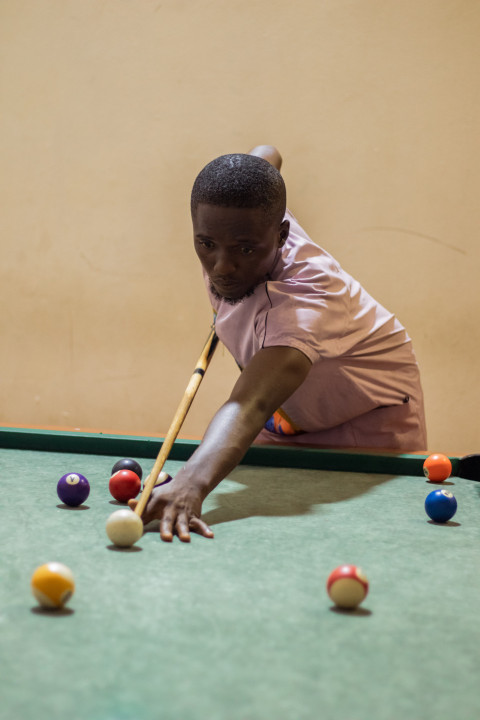 Boy playing snooker