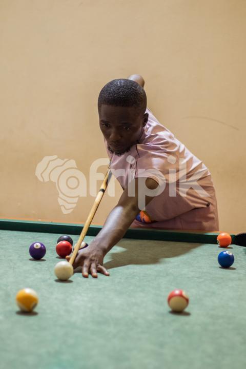 Boy playing snooker