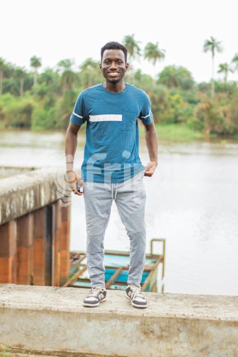 Boy standing at the bay