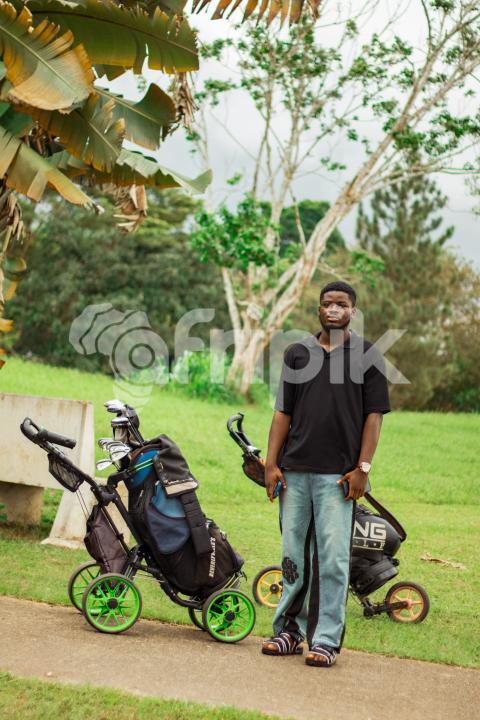 Boy in front cart golf bag