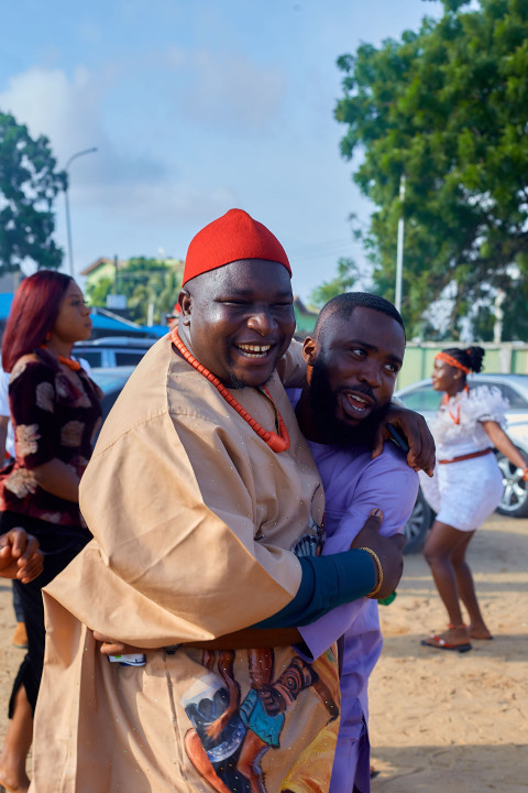 Cheerful men wearing traditional outfits