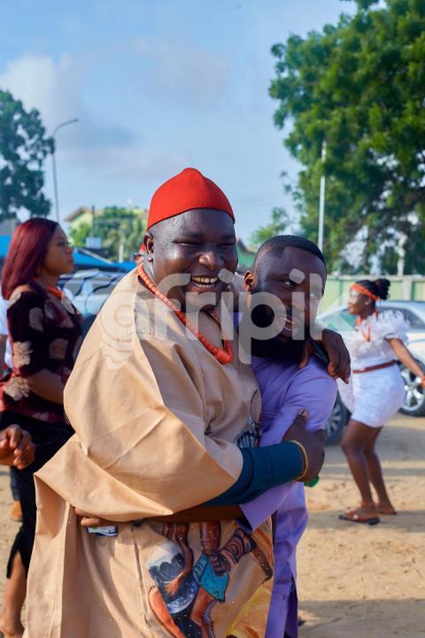 Cheerful men wearing traditional outfits