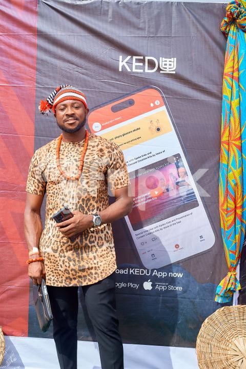 A Boy wearing a leopard skin shirt