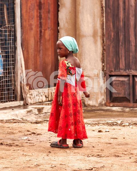 A girl wearing a red lace gown