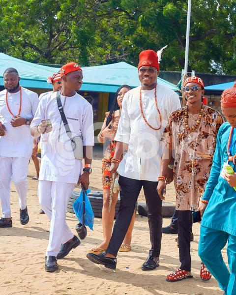 Men wearing traditional outfits walking